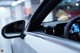 A close up of a car dashboard with a steering wheel.